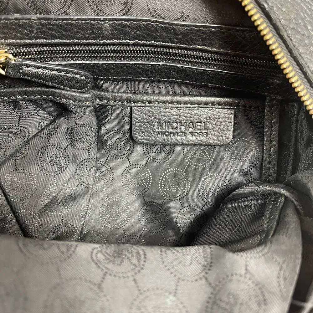 Michael Kors Black Pebble Leather Satchel with gold tone hardwares and accents.